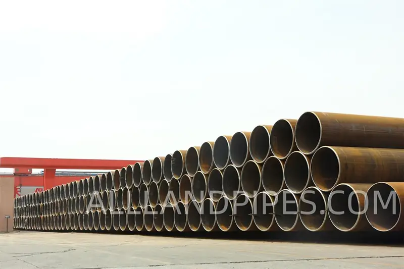 large diameter lsaw steel pipes in yard.