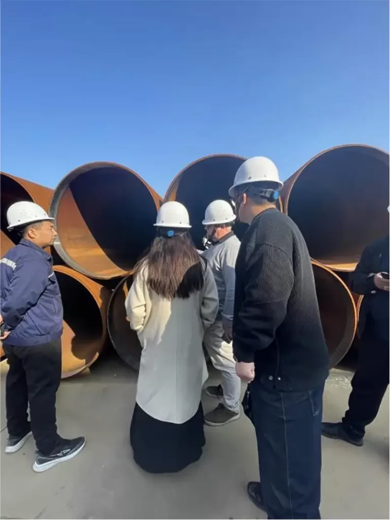 client inspecting high grade lsaw ssaw raw pipe.
