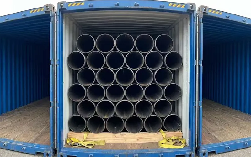 Interior view of a 40ft shipping container fully loaded with 11.8m fixed length API 5L steel pipes, demonstrating maximized loading efficiency and secure dunnage.-banner