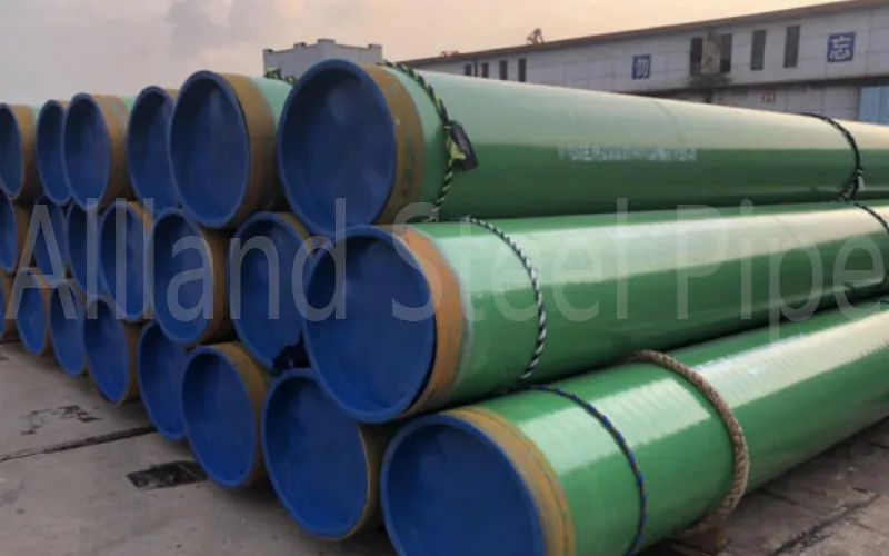 3LPE coated steel pipes stacked in yard for pipeline projects meeting DIN 30670, ISO 21809 and SY/T 0413 standards-banner