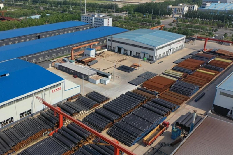 Aerial view of Allland Pipes welded steel pipe factory showing manufacturing workshops and large-diameter steel pipe storage yard