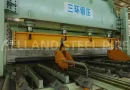Heavy-duty JCOE forming press bending a thick steel plate into a cylindrical shape during the manufacturing of large diameter LSAW steel pipe.-banner