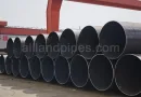 Large-diameter LSAW pipes made of various mild steel grades, including ASTM A36 and API 5L B, stacked in an outdoor storage yard for industrial infrastructure projects-banner