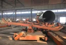 SSAW pipe (spiral submerged arc welded steel pipe) on the production line in an industrial factory-banner